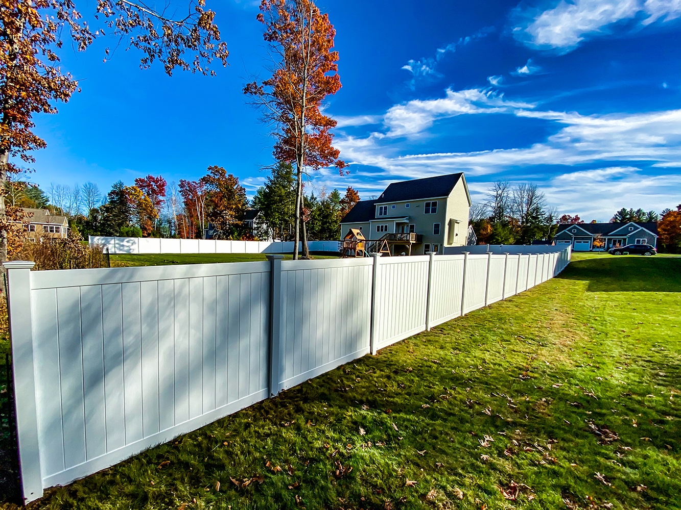 Photo of a white vinyl fence